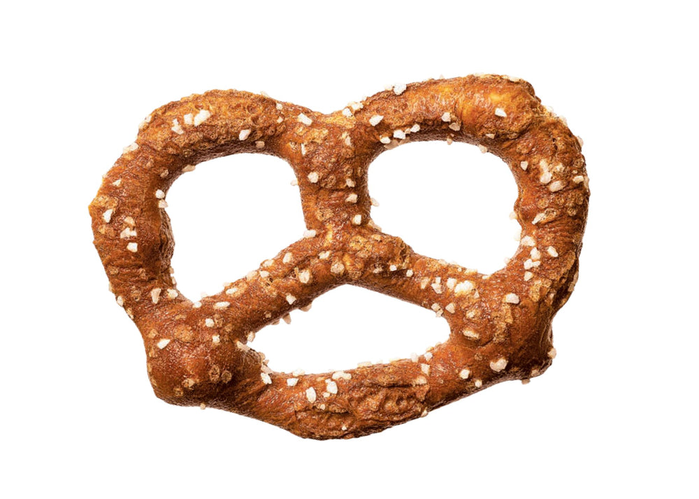 Unique Snacks pretzel held in hand for size reference and portability