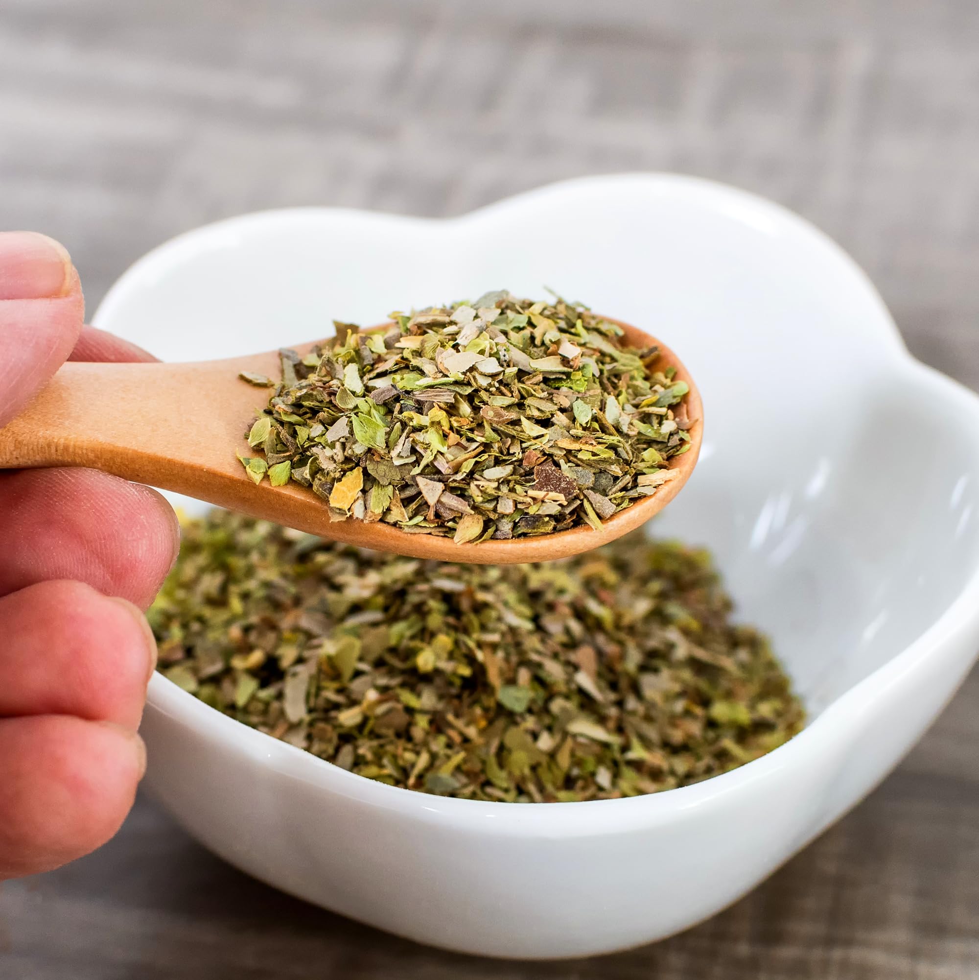 Jar of olive oil infused with Unpretentious oregano flakes adding savory aroma