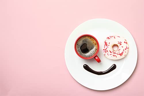 Unpretentious red jimmies scattered on frosted cupcake for visual pop