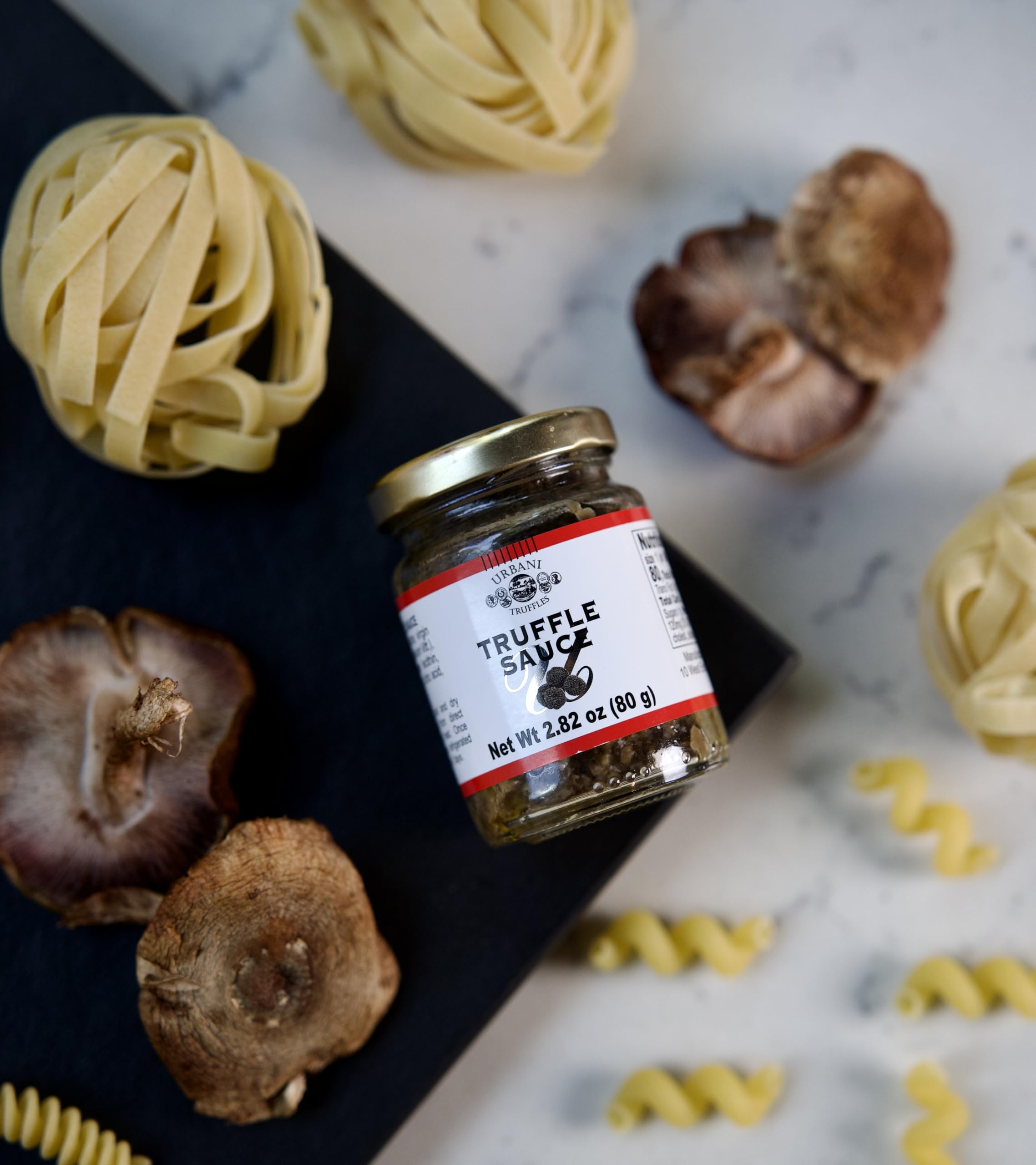 Urbani Truffles spread finishing pizza to preserve aroma and enhance flavor
