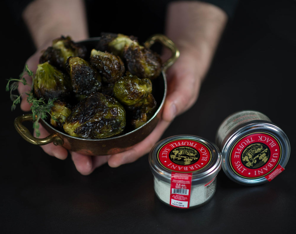 Urbani Truffles jar beside a teaspoon to show scale and easy portion control for cooking