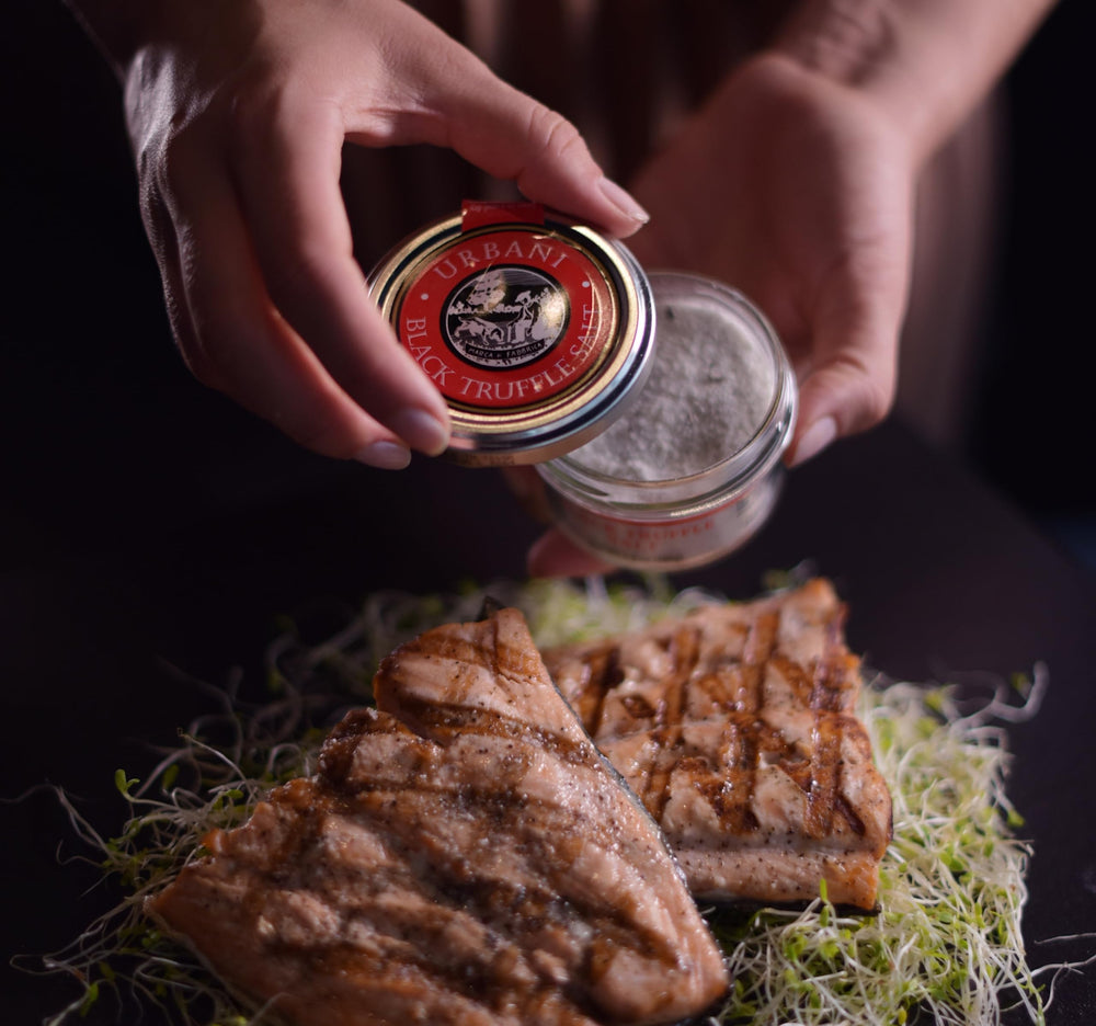 Urbani Truffles detailed view of real black truffle pieces mixed in salt to show authenticity