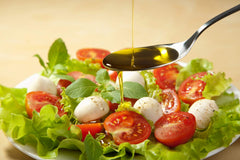 Urbani Truffles oil drizzled on pizza enhancing aroma and finishing flavor immediately