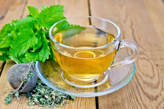 U.S. Wellness Naturals brewed lemon balm tea in cup illustrating calming, caffeine-free beverage