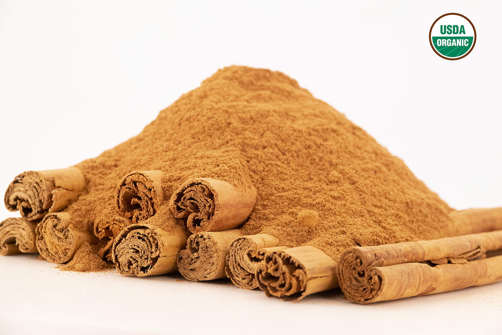 teaspoon of U.S. Wellness Naturals Ceylon cinnamon powder demonstrating portion size and easy measuring