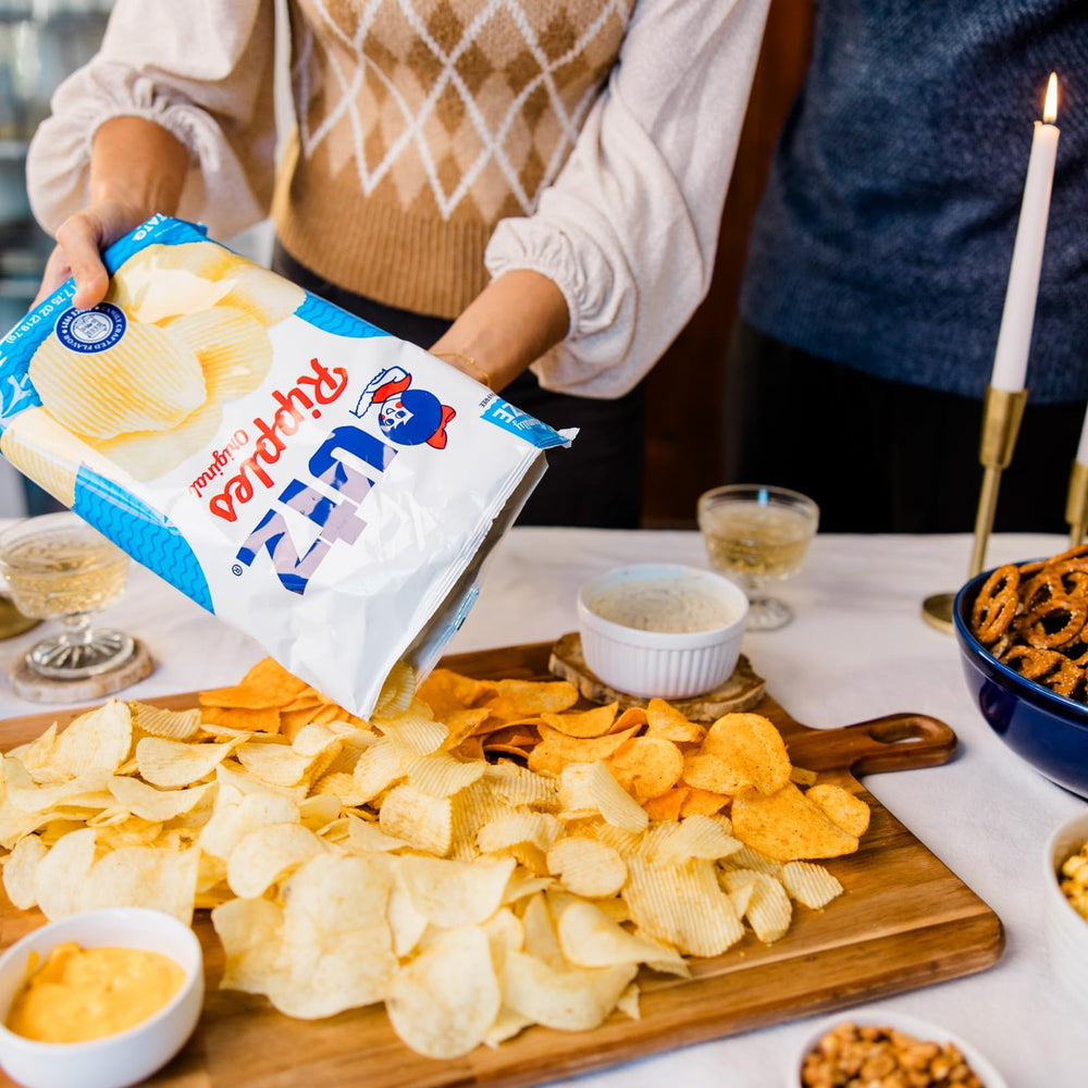 Utz family-size bag held in hand showing scale and shareable portion size