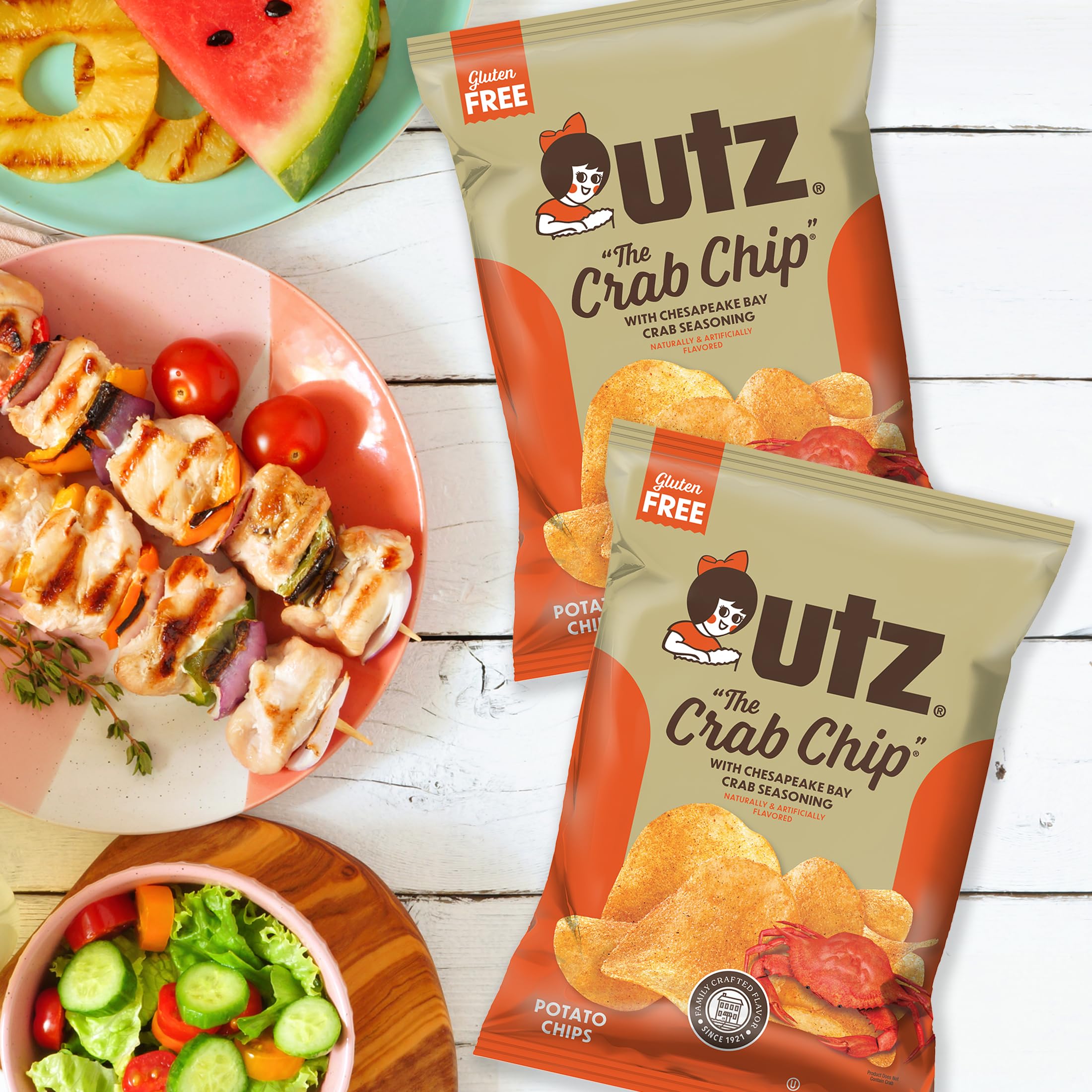 Hand holding an Utz 2.75 oz bag to show scale and portable snack-size benefit