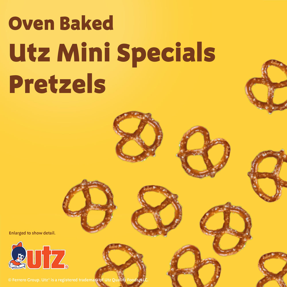 Utz mini pretzels held in hand showing crunch and portable benefit