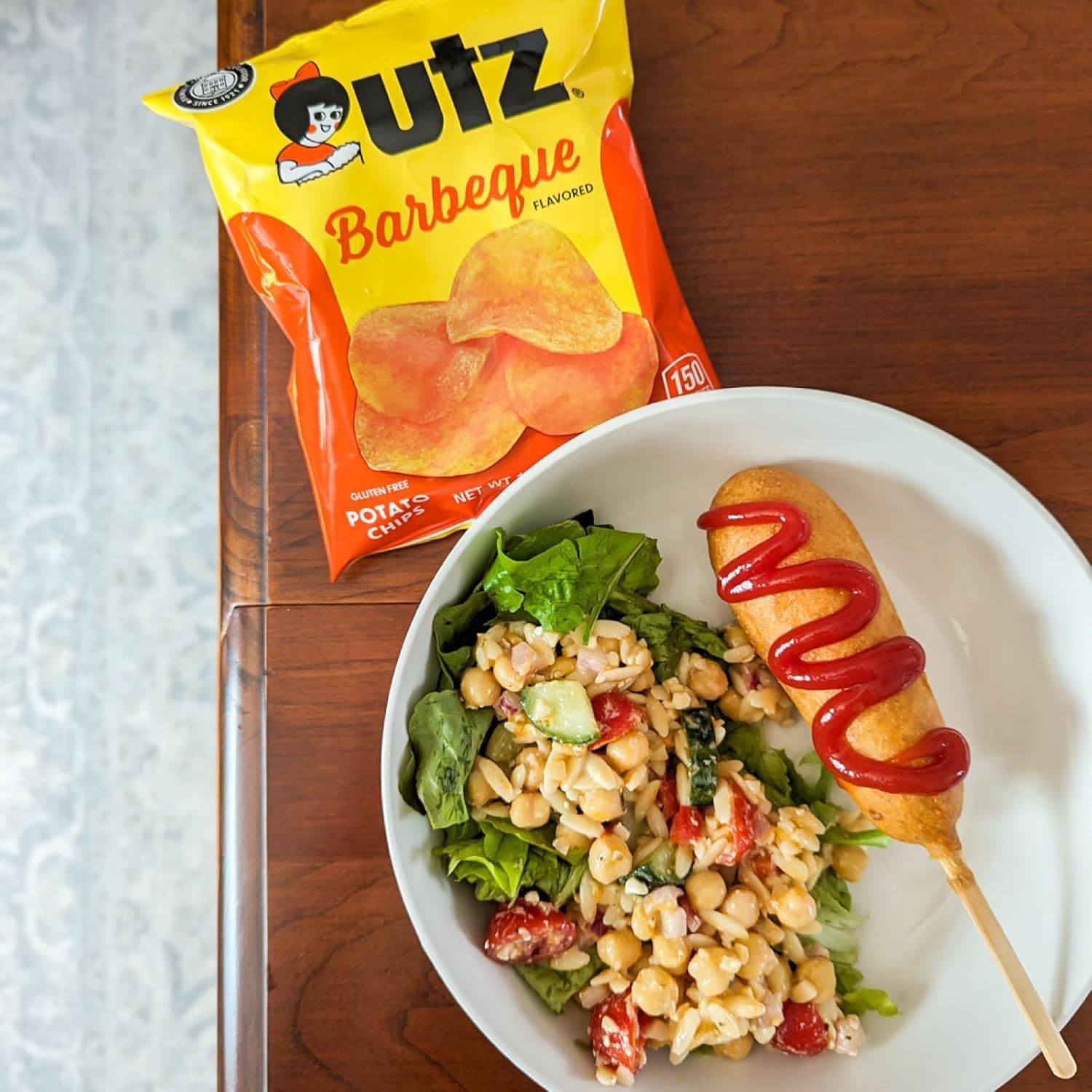 Lifestyle scene of Utz snacks on a party table conveying easy sharing and hosting
