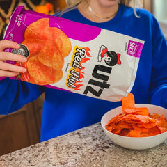 Utz single bag opened with chips inside showing convenient portion and freshness