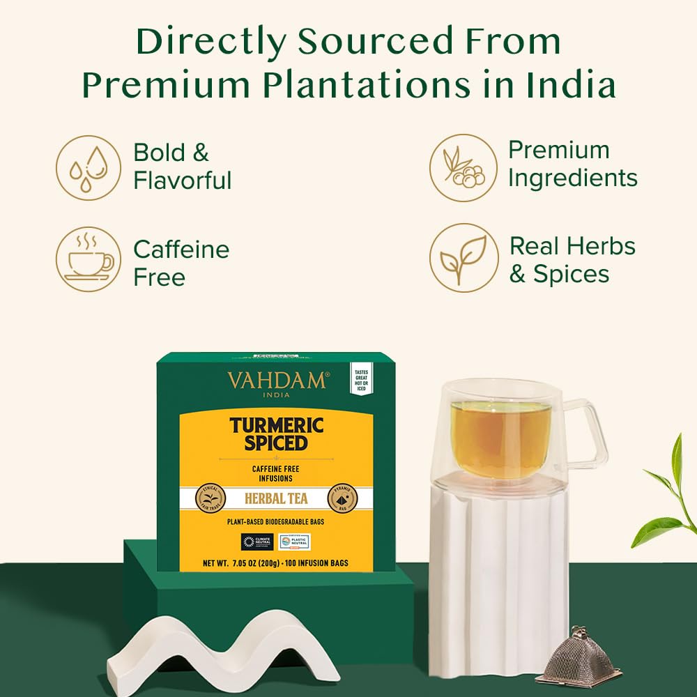 VAHDAM cup of steeped turmeric ginger cinnamon tea emitting warm steam, ready to sip