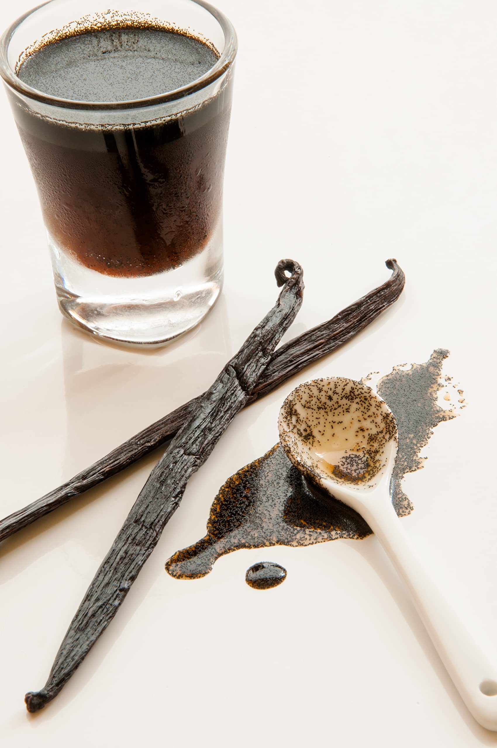 Vanilla Bean Kings jar beside teaspoon to show 32 oz size and cost-effective volume