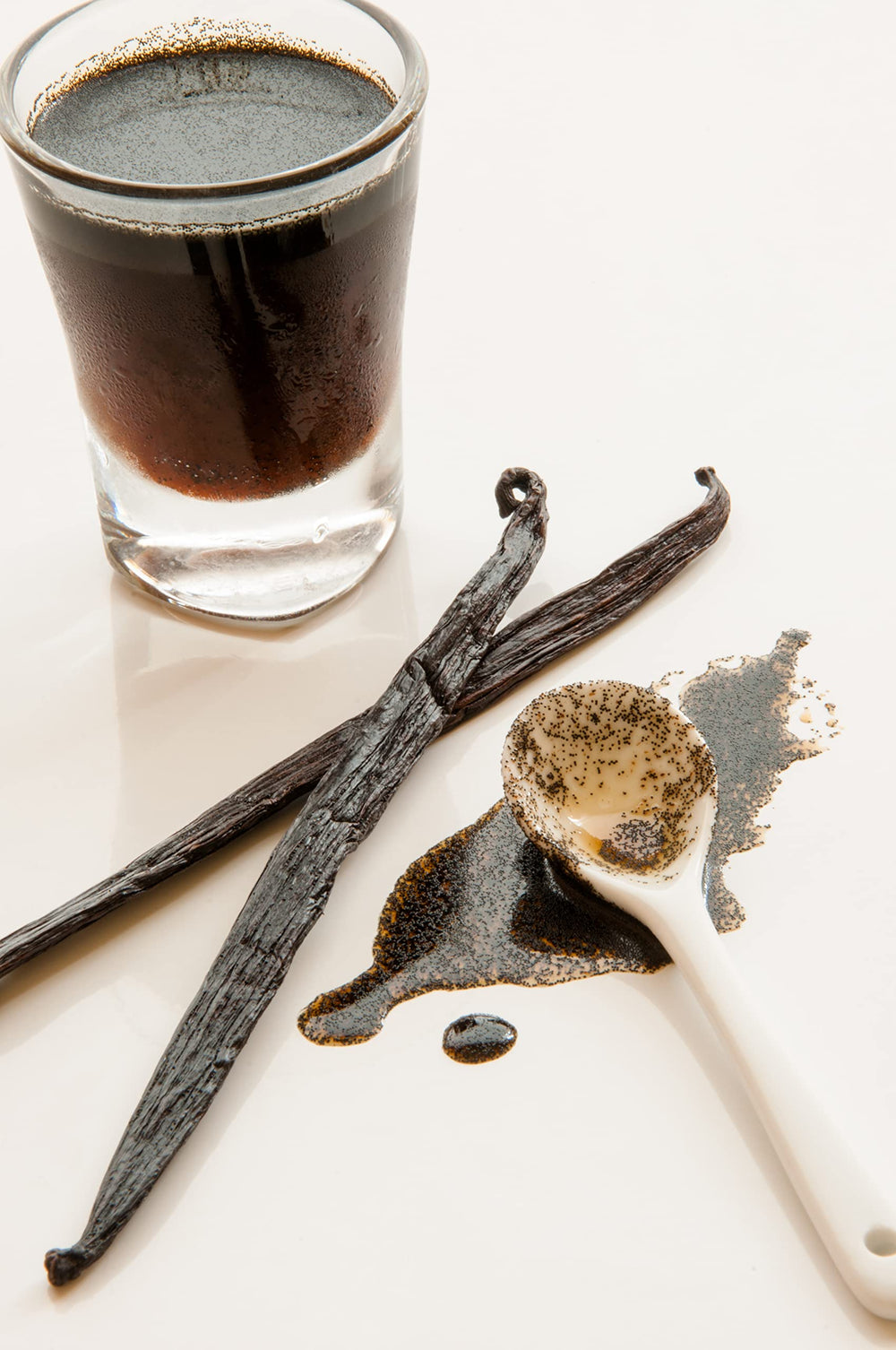 Vanilla Bean Kings jar beside teaspoon to show 32 oz size and cost-effective volume