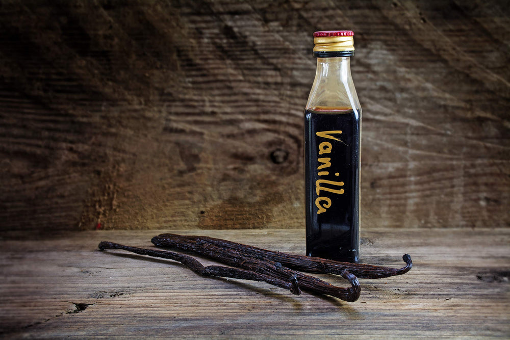 Vanilla Bean Kings pods beside ruler showing 5–6 inch length accuracy
