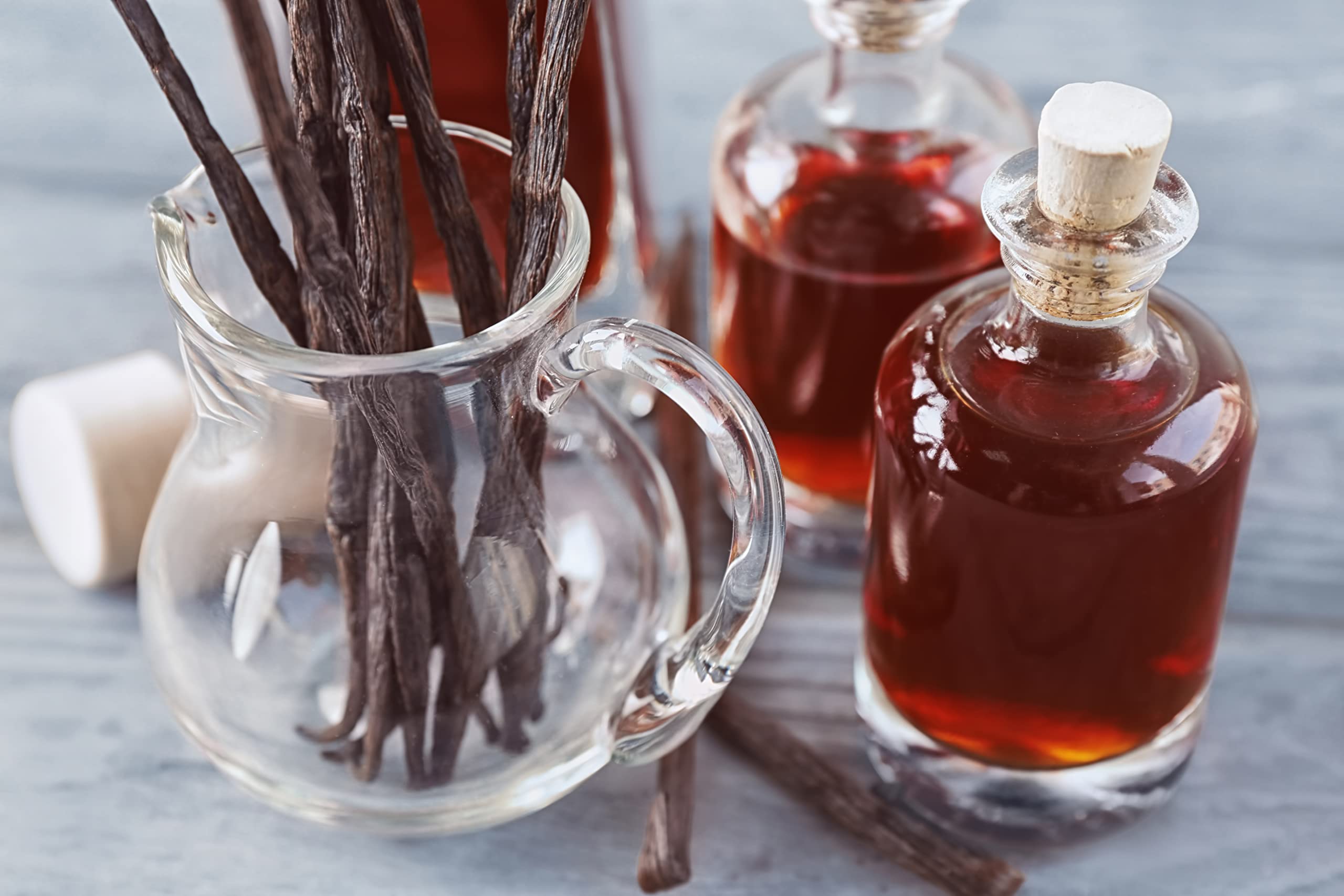Vanilla Bean Kings bottle staged with baked goods showing improved dessert flavor benefit
