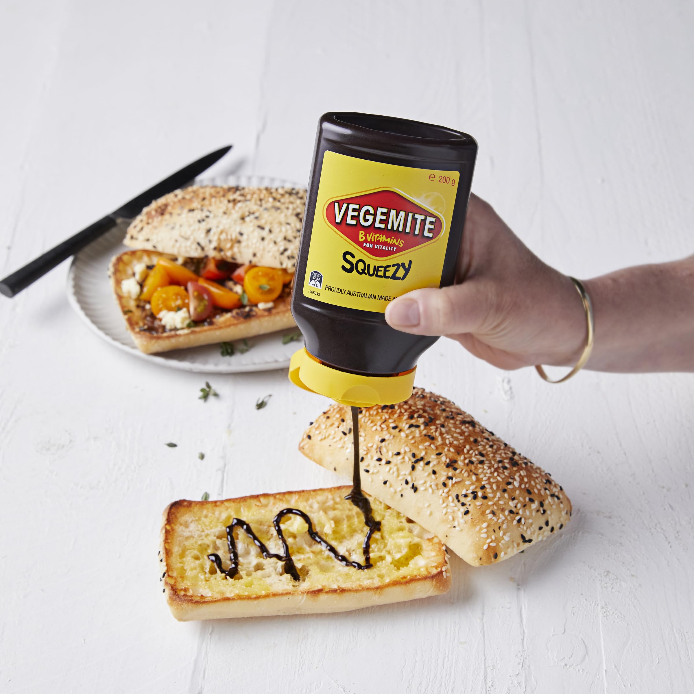 Vegemite Squeezy nozzle close-up with controlled flow for mess-free spreading