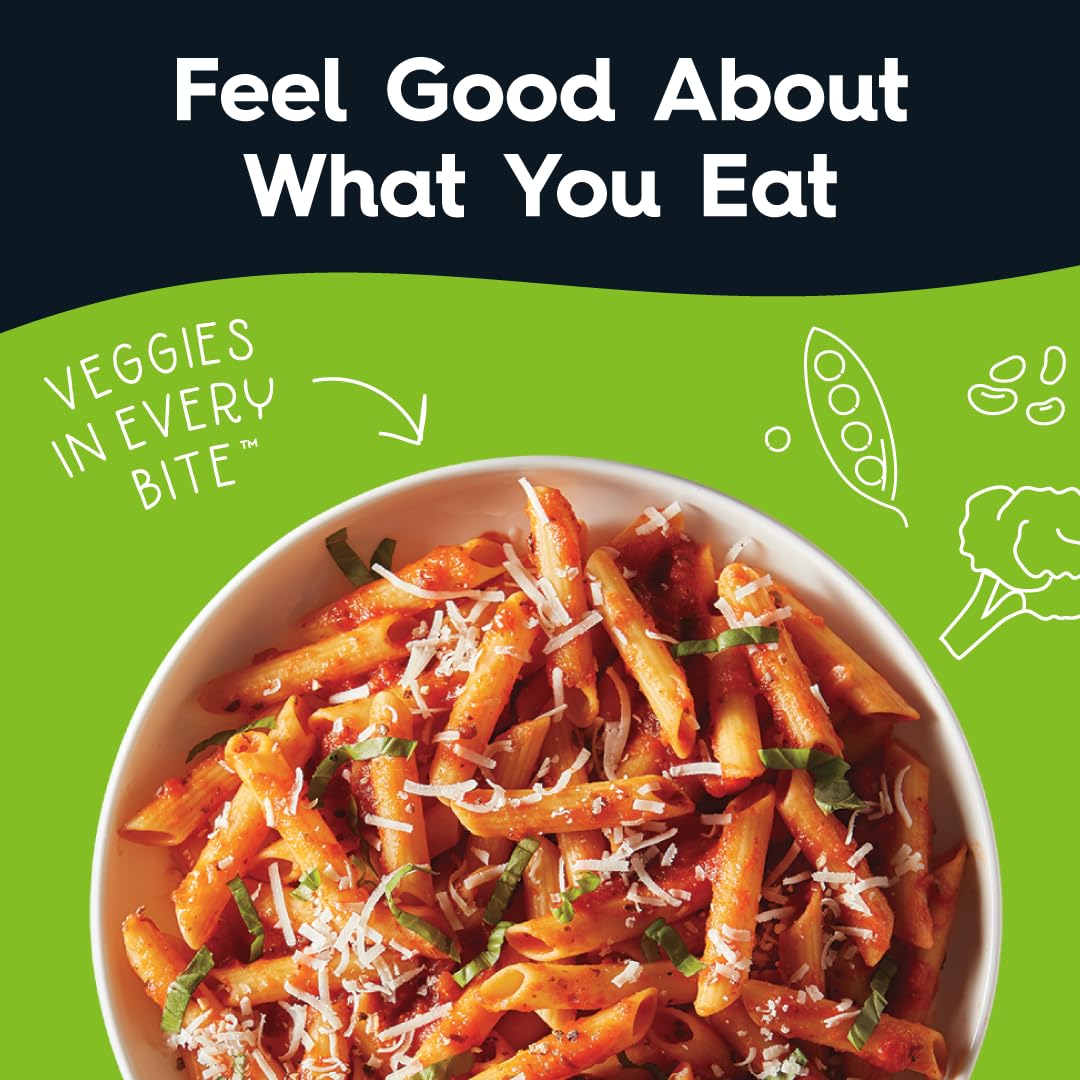 Veggiecraft Farms uncooked penne close-up highlighting vegetable-based texture and shape