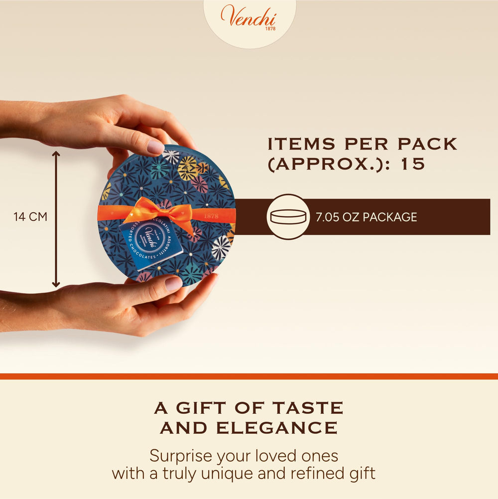 Venchi hamper held in hand to show compact size and convenient gifting suitability