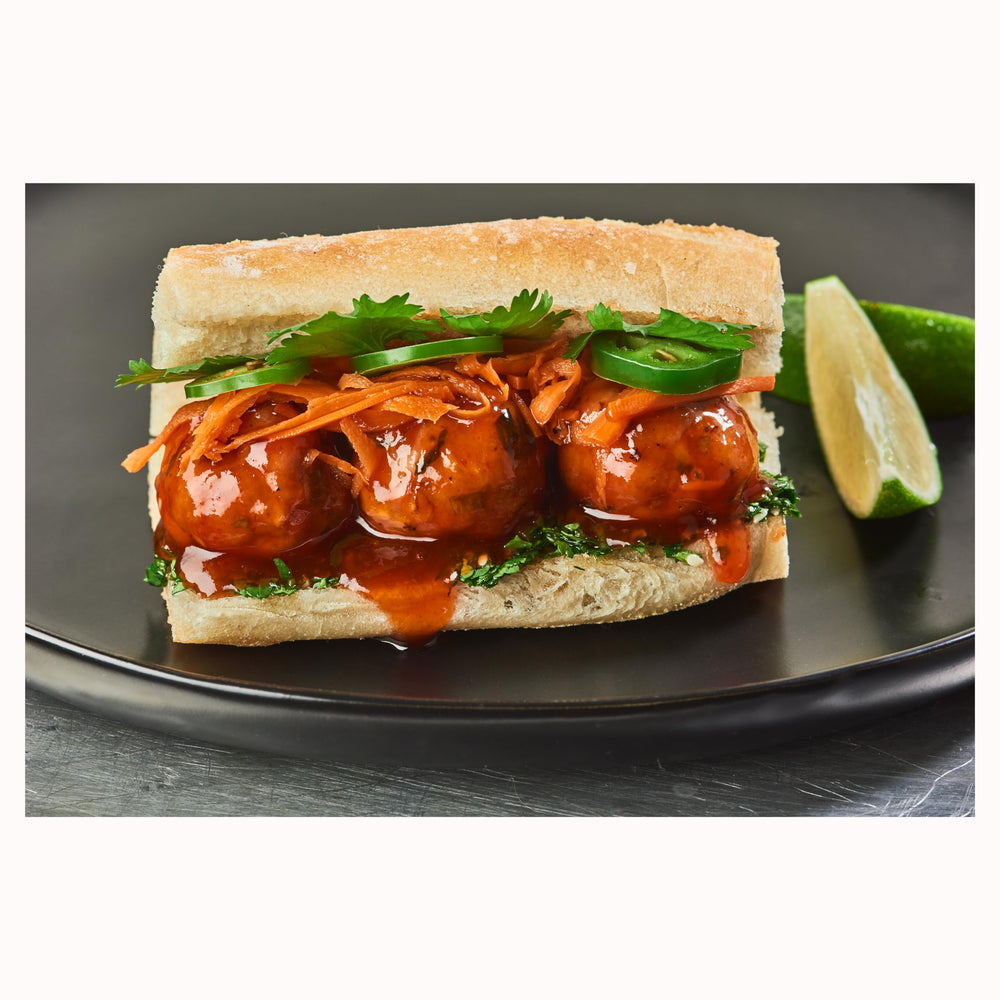 Ventura Foods glazed wings with sauce applied showing appetizing color and shine