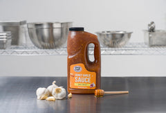 Ventura Foods sauce being poured from bottle demonstrating easy dispensing benefit