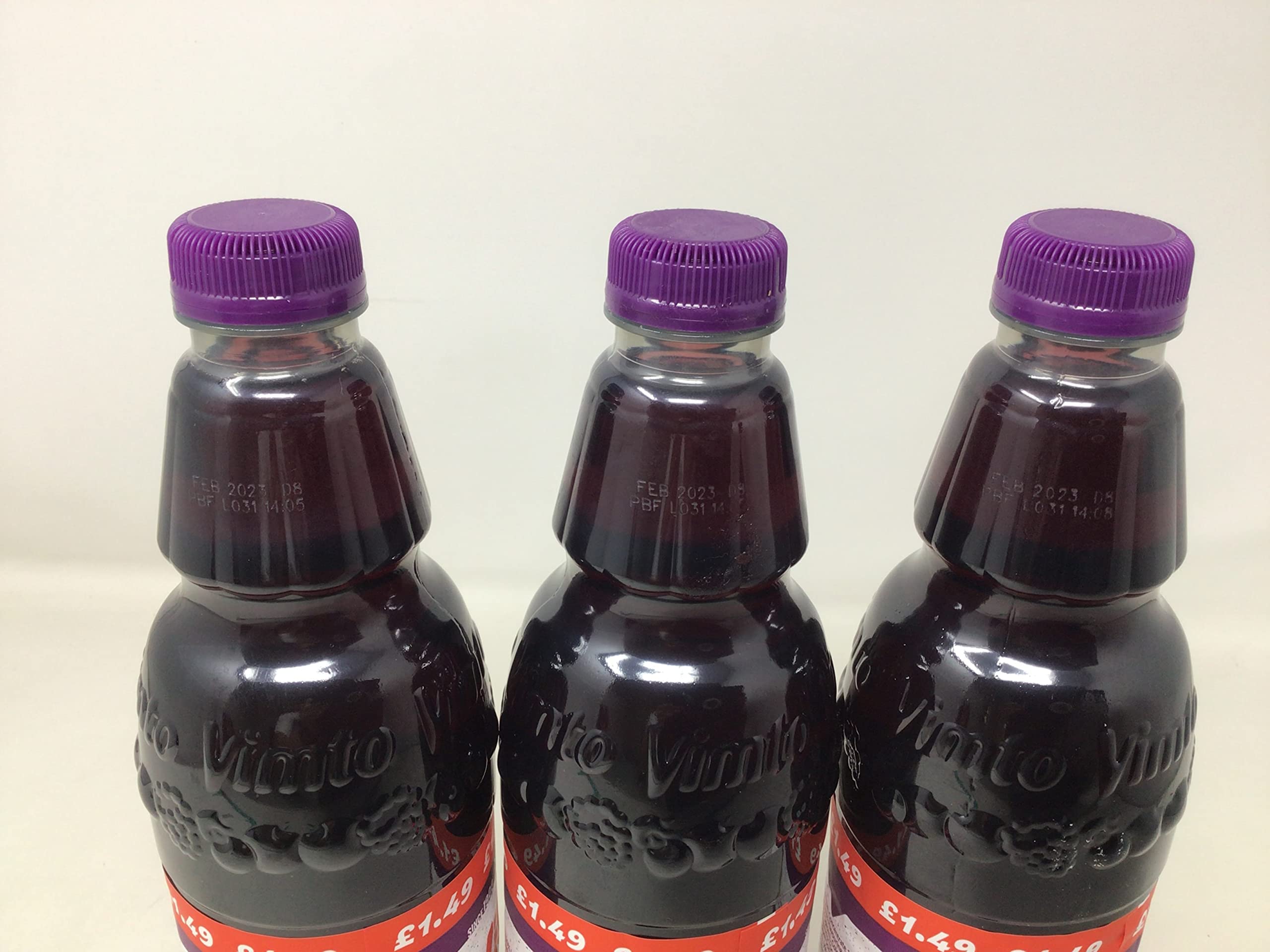 Three-pack of Vimto squash on a table in a casual setting ideal for parties and family use