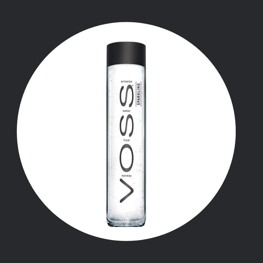 VOSS bottle in hand size comparison demonstrating portable, single-serve benefit