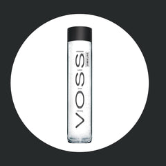 VOSS bottle in hand size comparison demonstrating portable, single-serve benefit