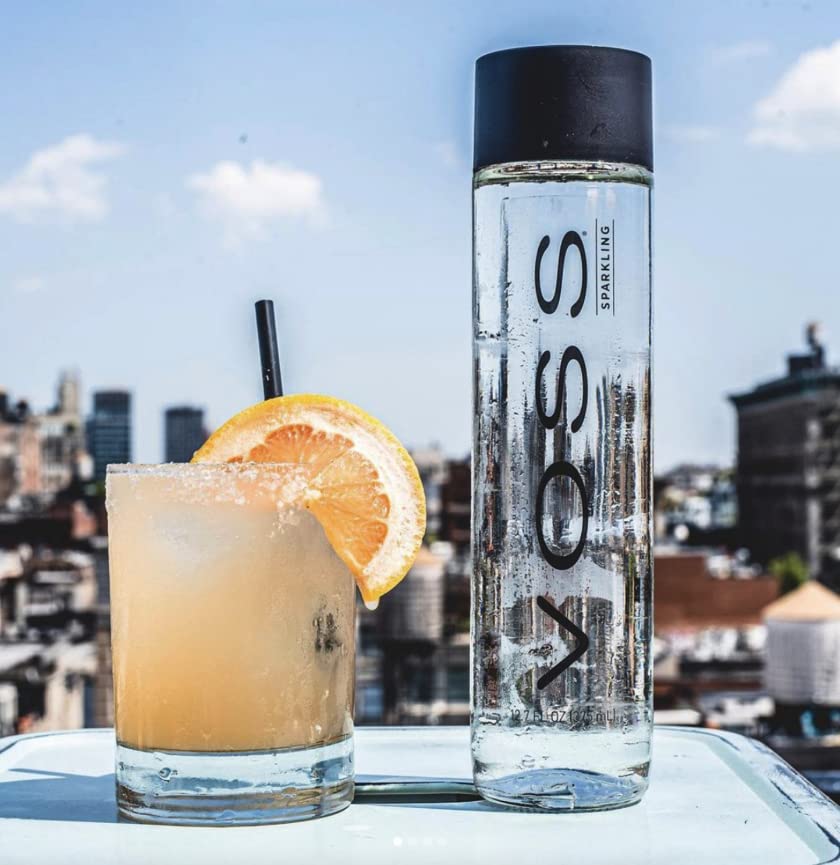 VOSS bottles on dining table lifestyle scene promoting stylish entertaining benefit