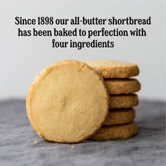 Walker's tin opened to reveal Scottie dog cookies preserved inside