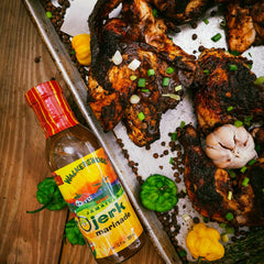 Walkerswood sauce being brushed on chicken at the grill delivering caramelized flavor benefit