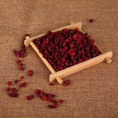wananfu close-up of schisandra berry texture, visible moisture and freshness