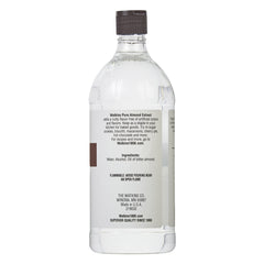 Watkins close-up of amber extract liquid, highlighting pure almond concentration