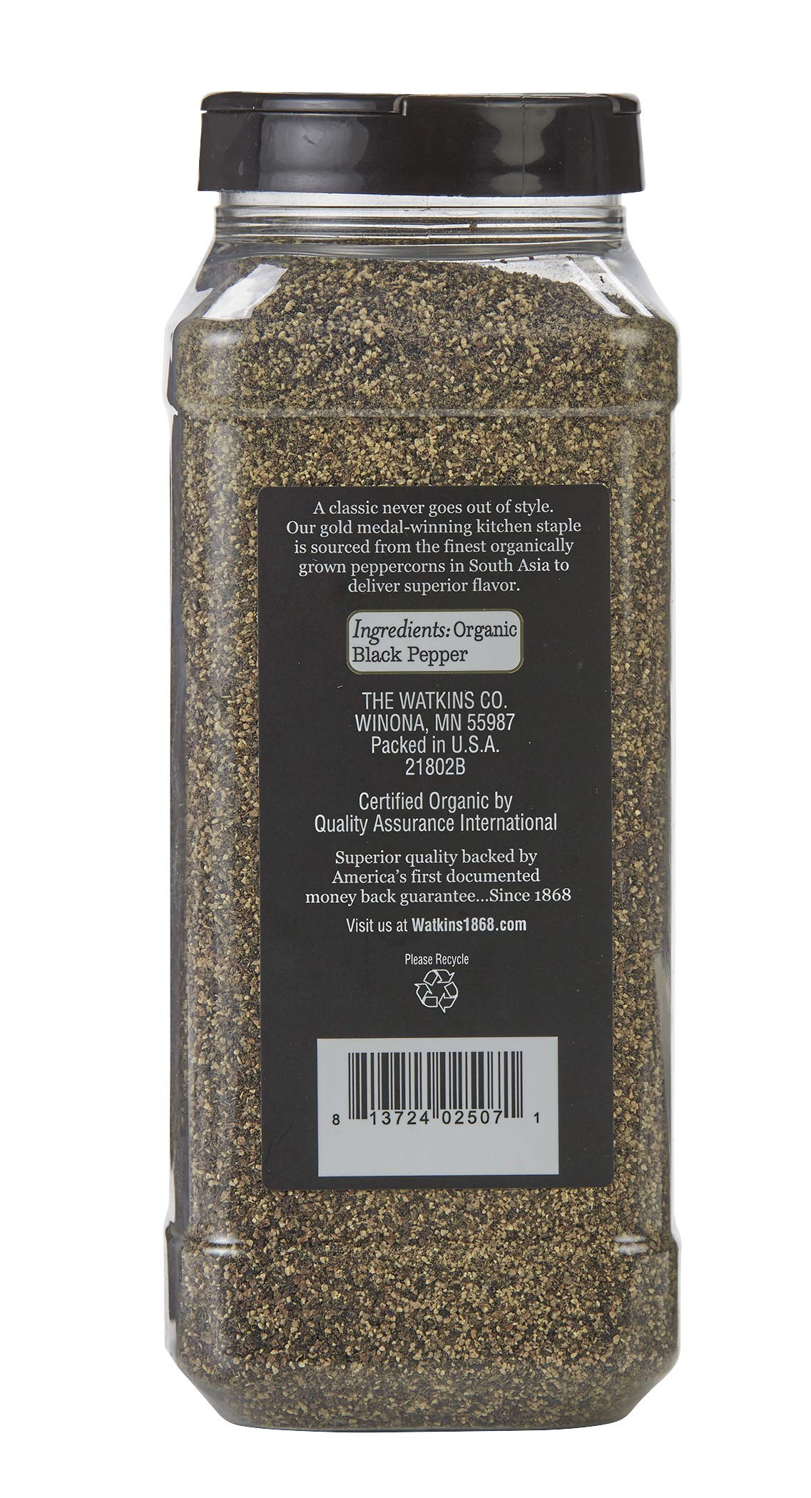 Close up of Watkins ground black pepper granules highlighting fresh aroma and texture