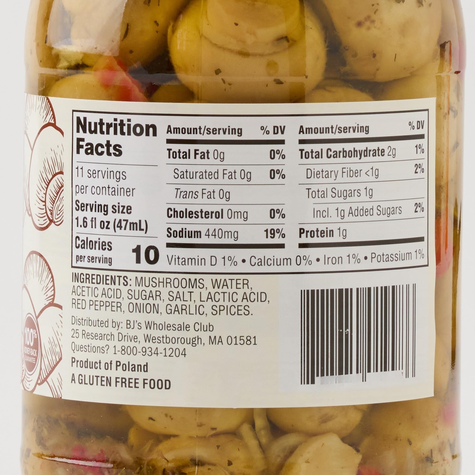 Wellsley Farms jar held in hand to show 30.36 oz club-size scale and value