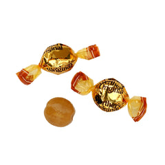 Single Werther's candy in hand for scale, THE HAMPTON CANDY COMPANY demonstrating portion size and portability