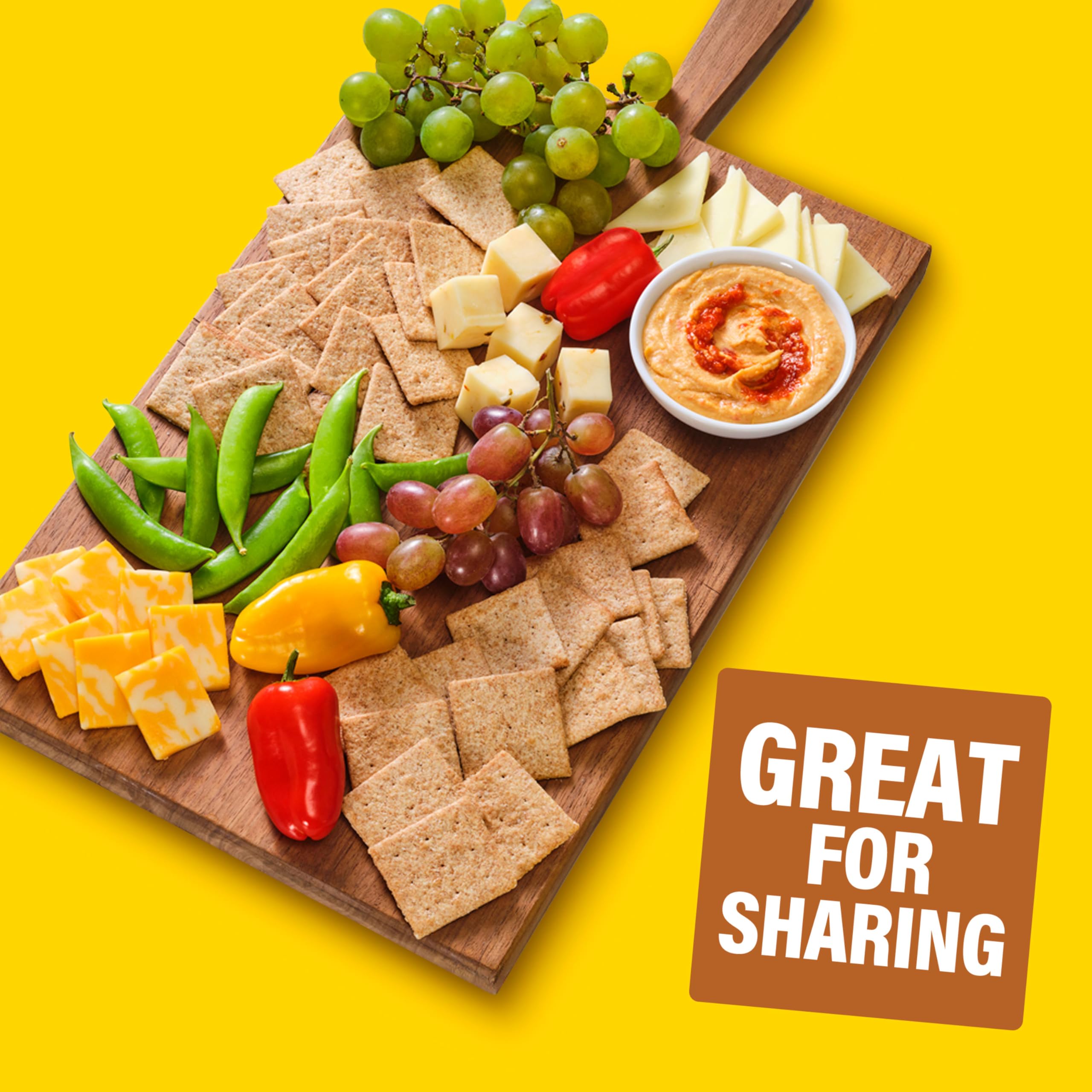 Wheat Thins arranged on a charcuterie board adding crunchy contrast to meats