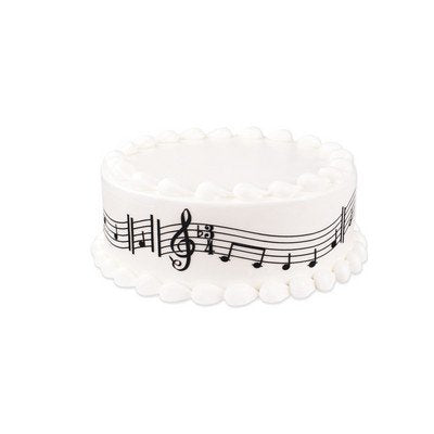 Whimsical Practicality strip being placed on frosted cake demonstrating fast professional finish