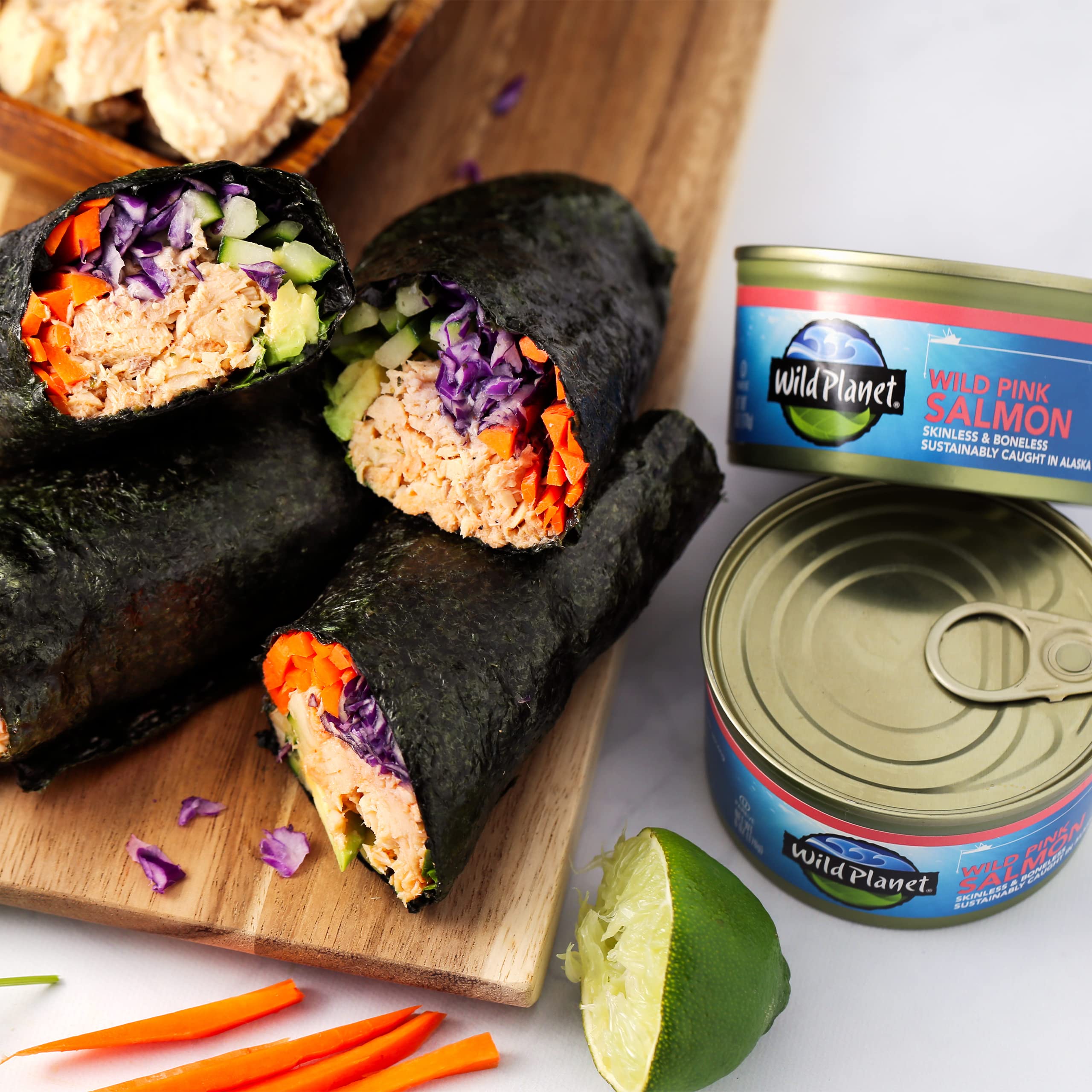 Wild Planet can held in hand illustrating 6 ounce size and portion control