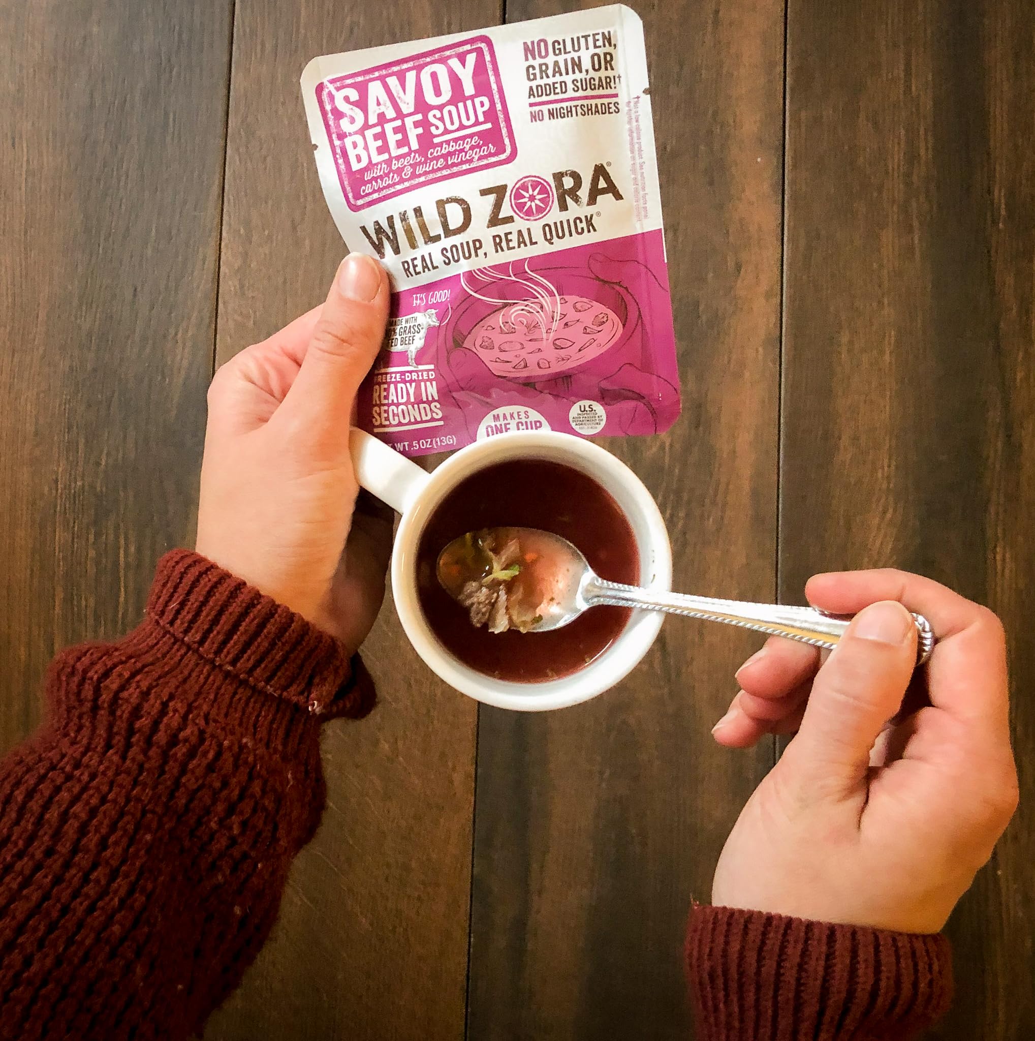 Wild Zora scale comparison with spoon showing single-serve portioning