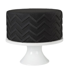 Wilton black fondant texture close-up highlighting smooth, pliable surface for clean drapes