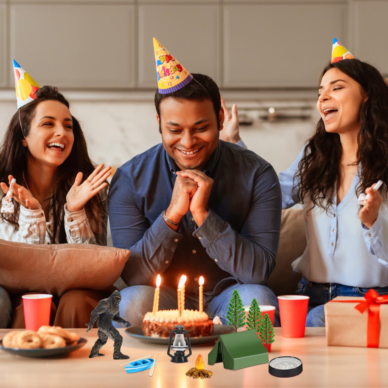 Woanger toppers placed on birthday cake creating instant camping theme