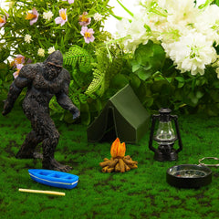 Woanger assorted trees and lamp arrangement adding depth to cake scene