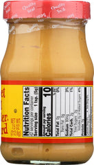Woeber Mustard Mfg. Co. bottle next to a hand for size comparison and easy storage benefit