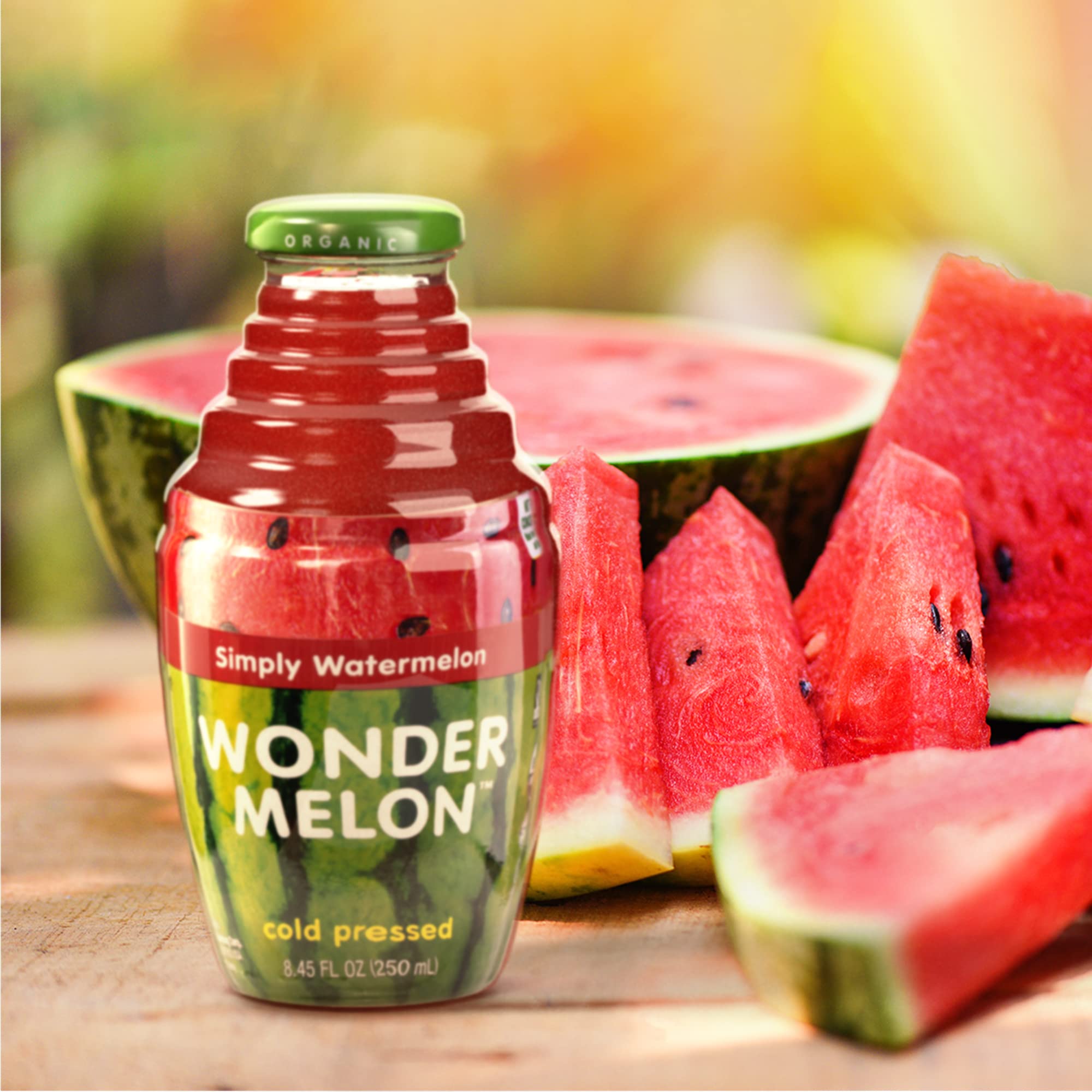 Wonder Melon close-up pour of red watermelon juice highlighting cold-pressed texture and freshness