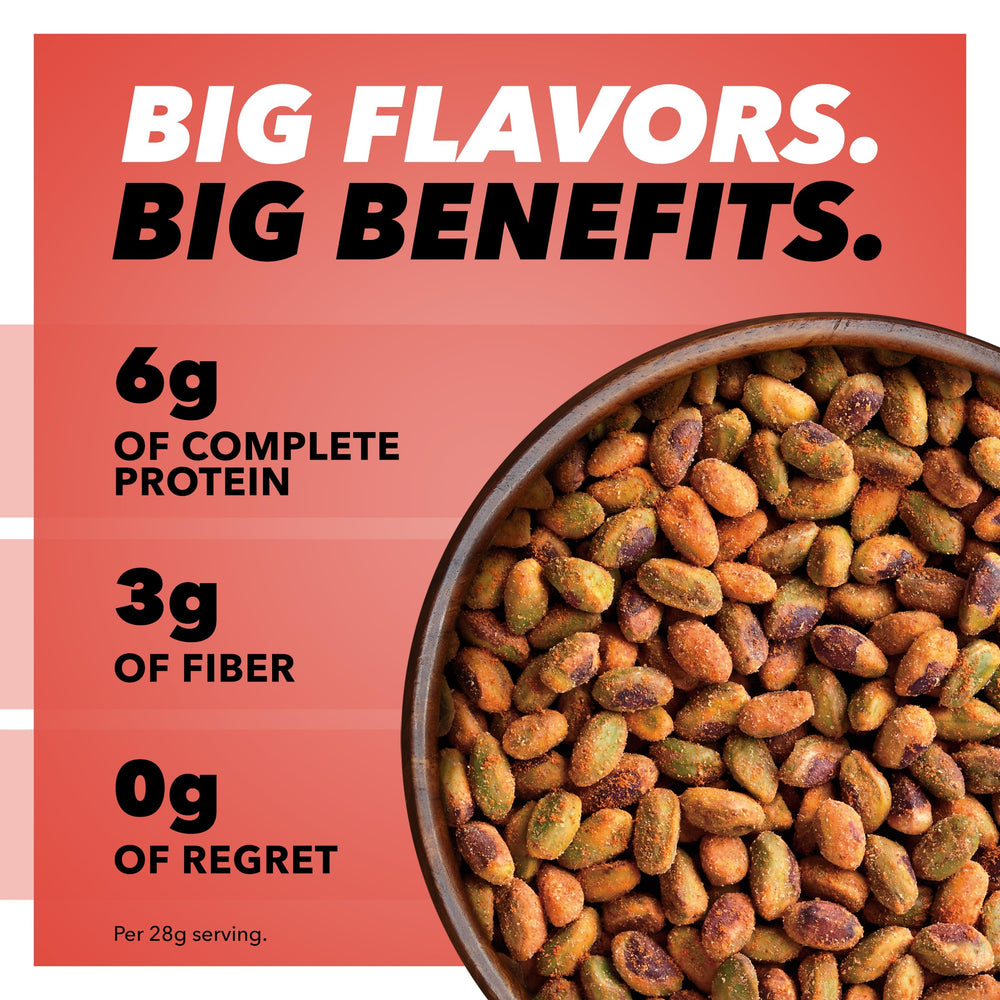 Close-up of chili roasted pistachio kernels showing seasoning texture and bold flavor