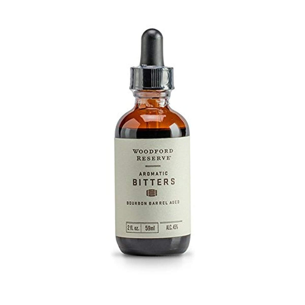 Woodford Reserve aromatic bitters vial front showing label and bourbon-aged benefit