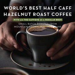 World's Best Half Caff pod close-up displaying pod seal and flavor label for freshness