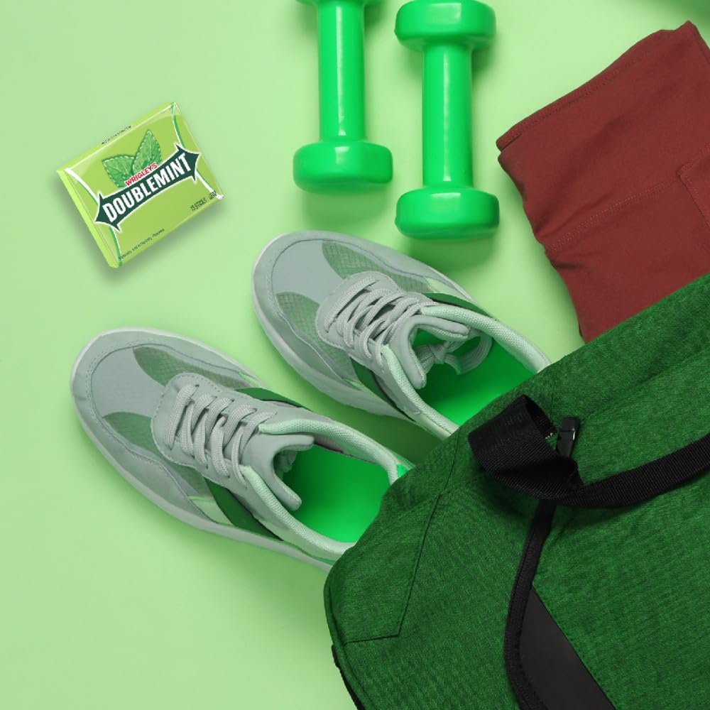 Wrigley's pack in hand illustrating size and portability for on-the-go refreshment