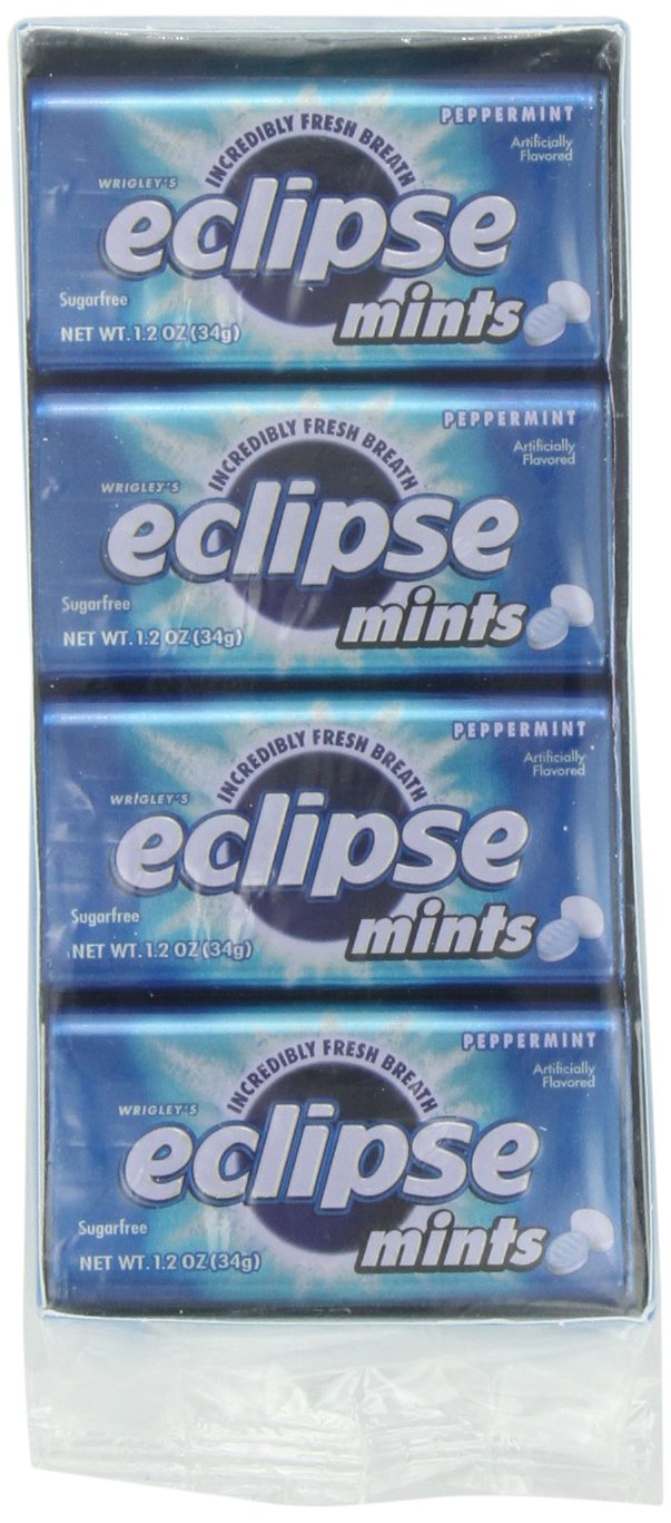 Wrigley's Eclipse tubs beside a coin showing compact size and pocket portability