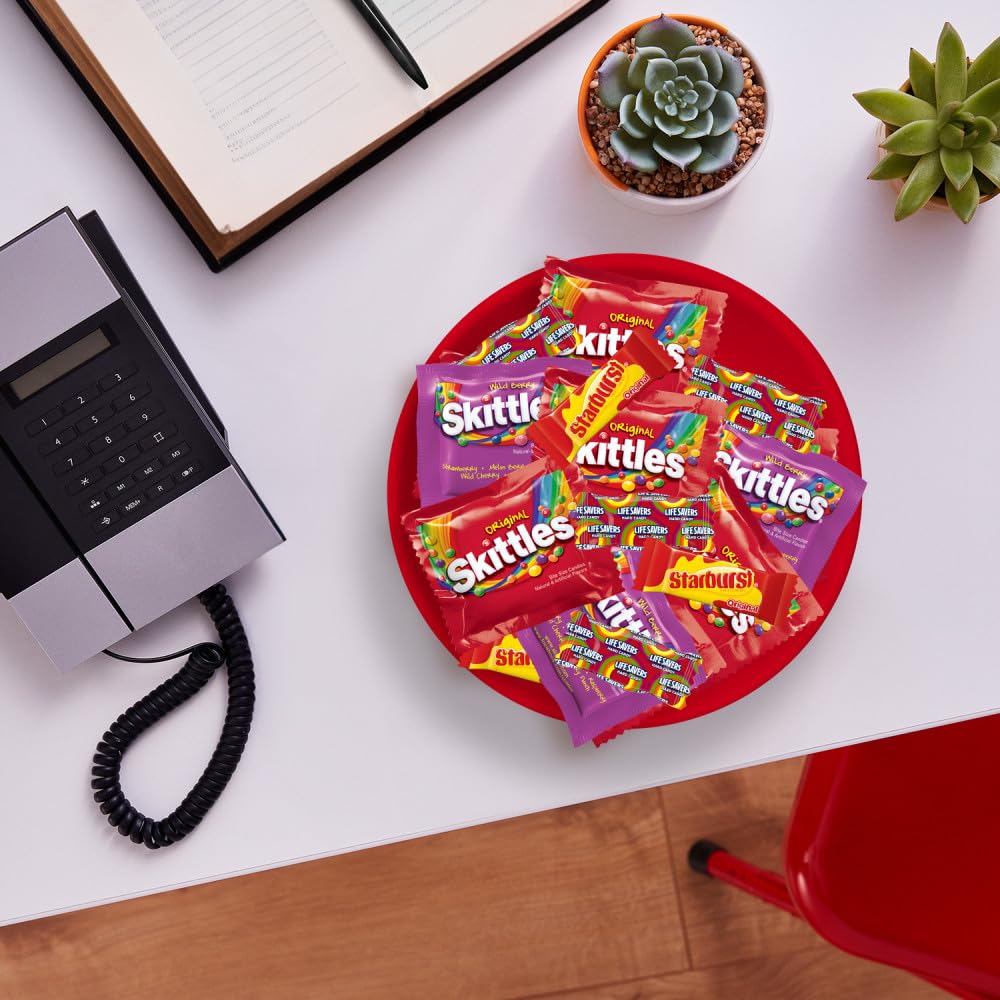Wrigley's SKITTLES Wild Berry pieces piled to show vibrant colors and fruity taste